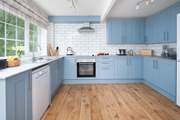 Tranquil blues in the well-equipped, stylish kitchen. 