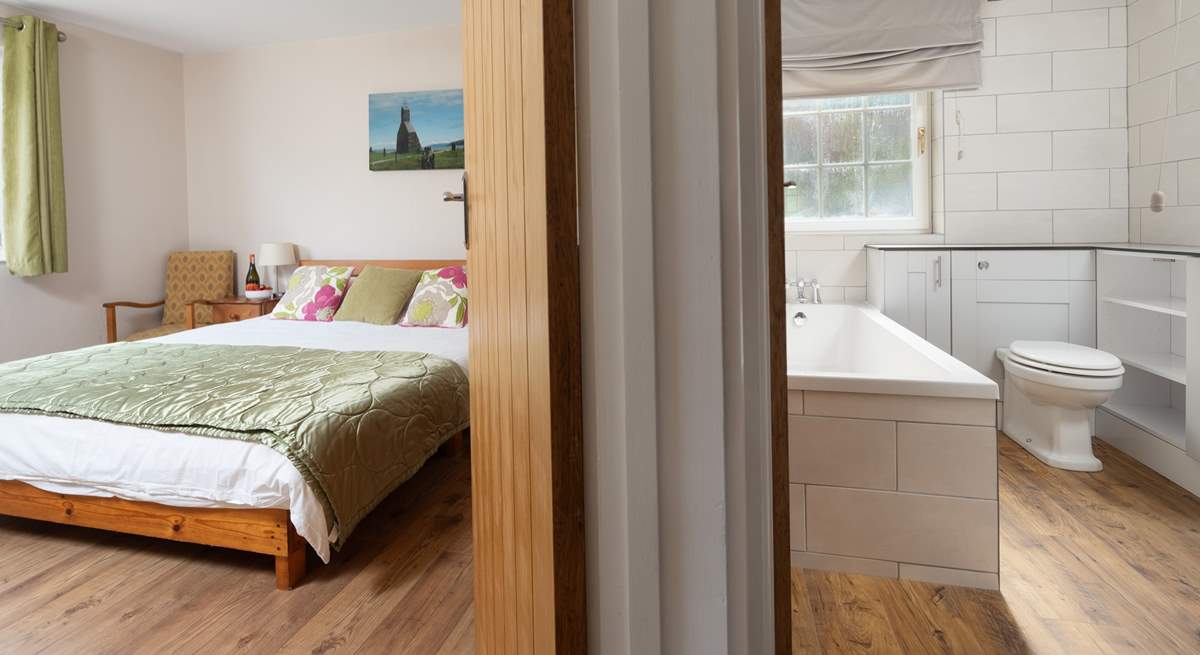 The king-size bedroom is adjacent to the family bathroom. You choose, bath or shower. 