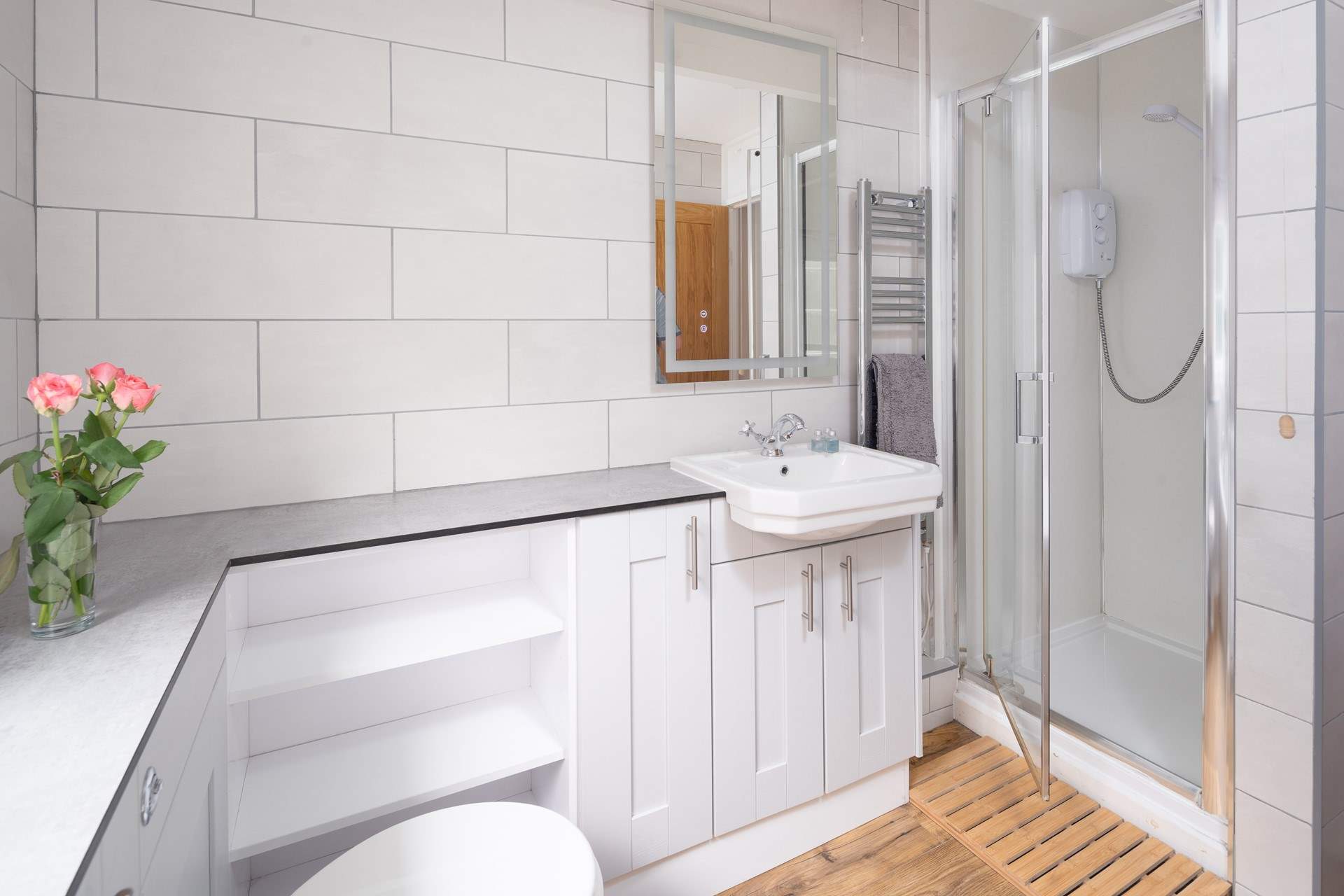 A choice of a shower or bath in the family bathroom. 