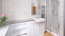 A choice of a shower or bath in the family bathroom. 