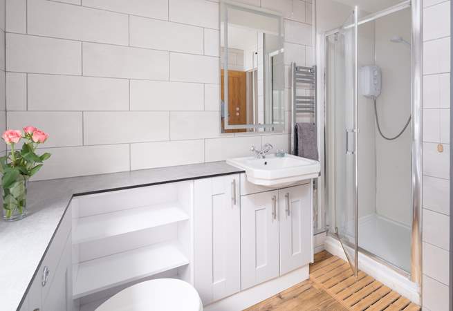 A choice of a shower or bath in the family bathroom. 