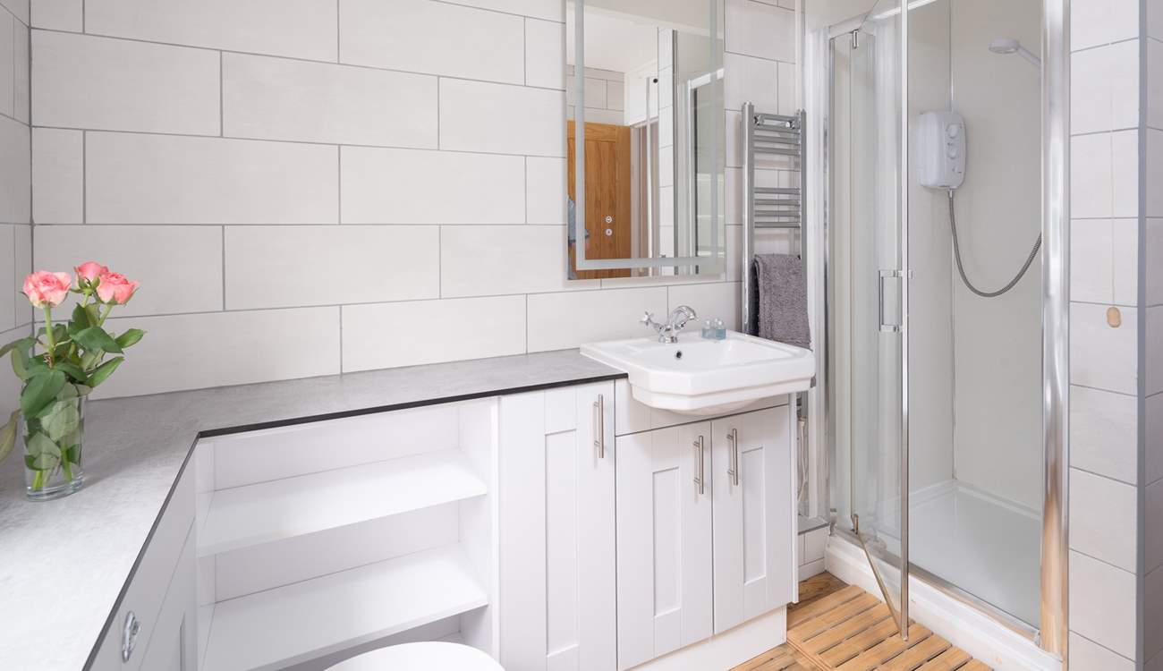 A choice of a shower or bath in the family bathroom. 