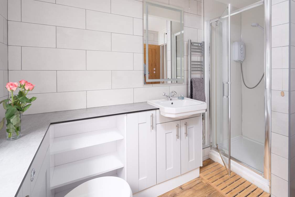 A choice of a shower or bath in the family bathroom.