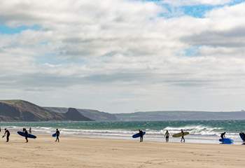 Newgale, with swathes of golden sands and rolling surf. 