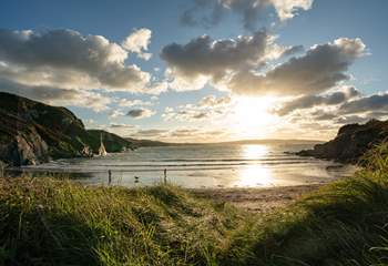 The sun going down over enchanting Pwllgwaelod Beach. 