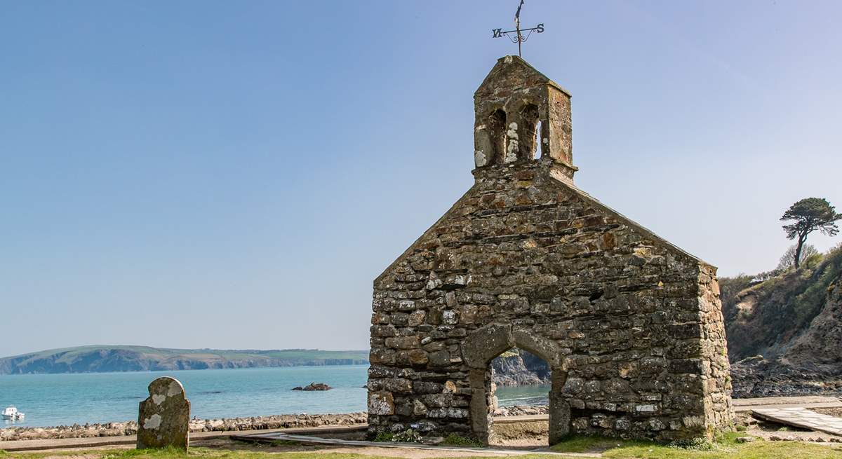 Just above the beach, the bell tower of St Brynach's church is still standing after the great storm of 1859.