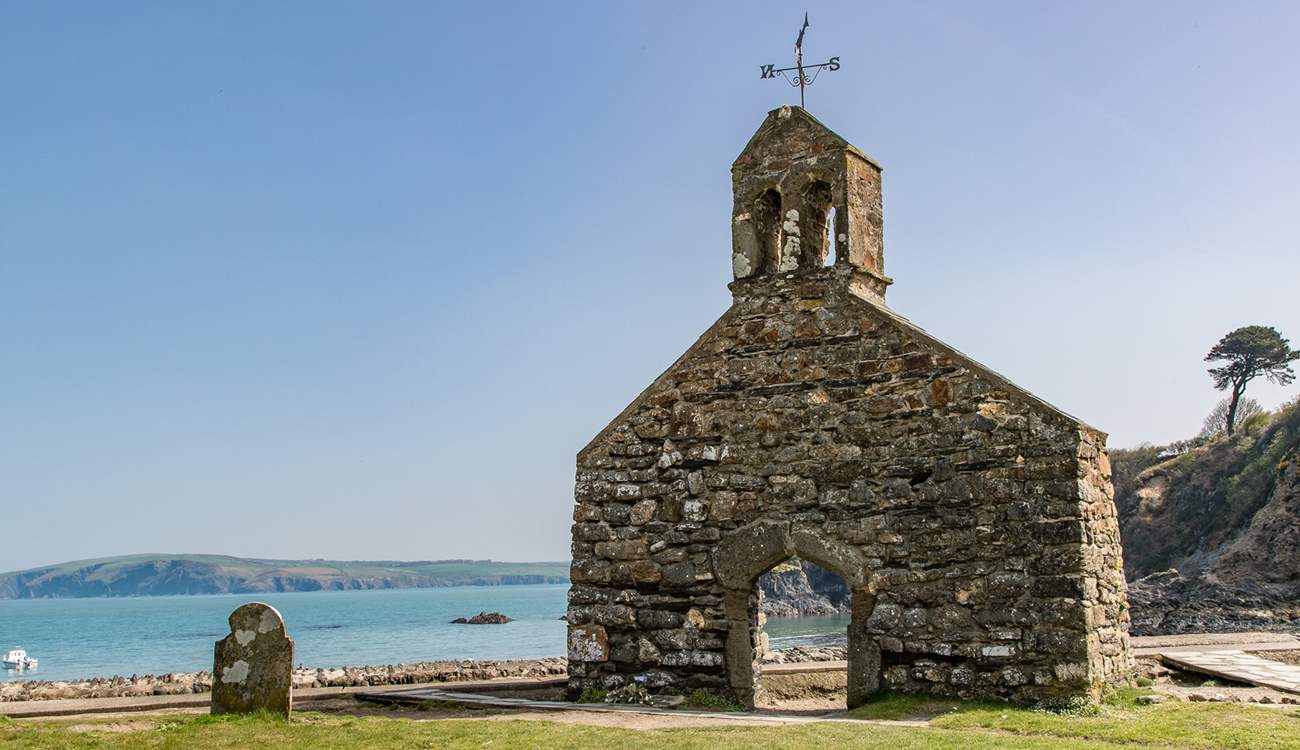 Just above the beach, the bell tower of St Brynach's church is still standing after the great storm of 1859.