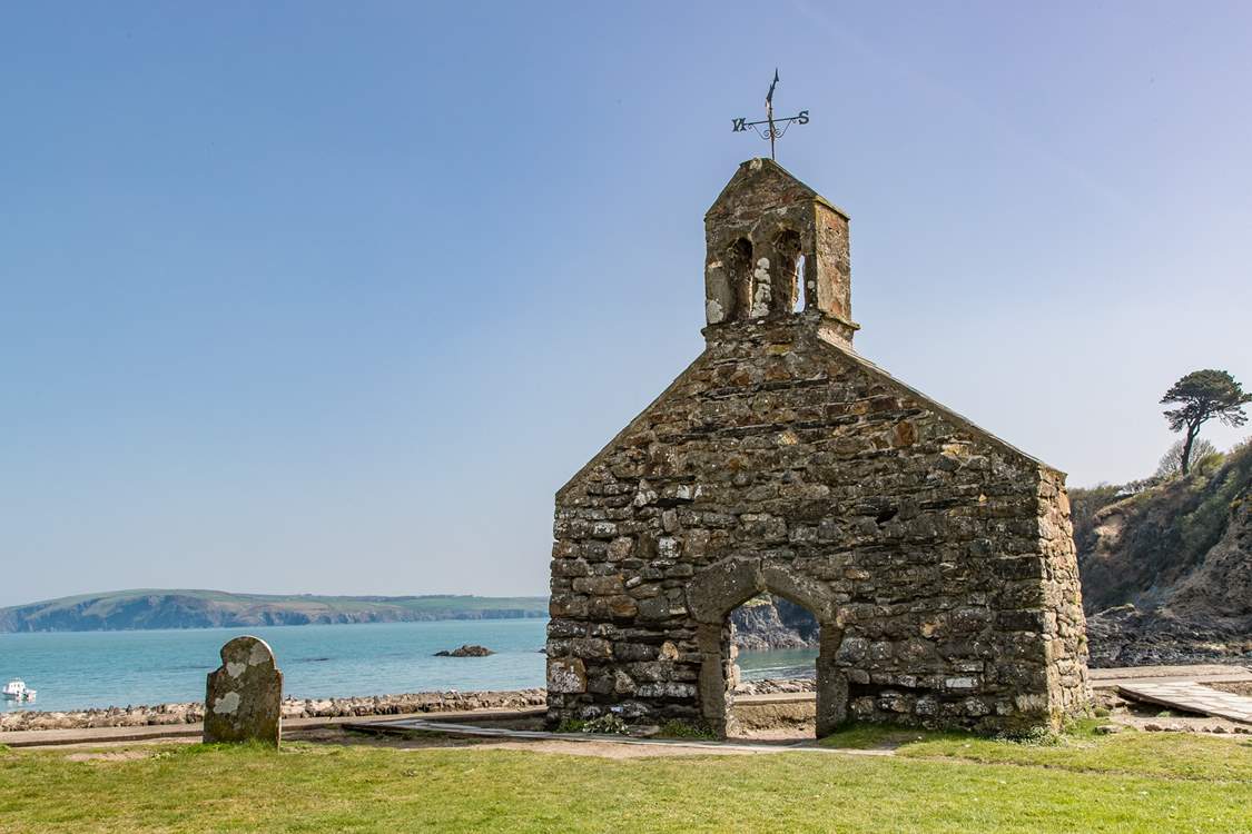 Just above the beach, the bell tower of St Brynach's church is still standing after the great storm of 1859.