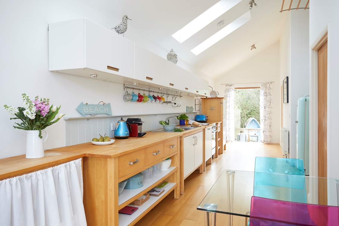 The open plan living space runs the length of the property and is light and bright throughout.