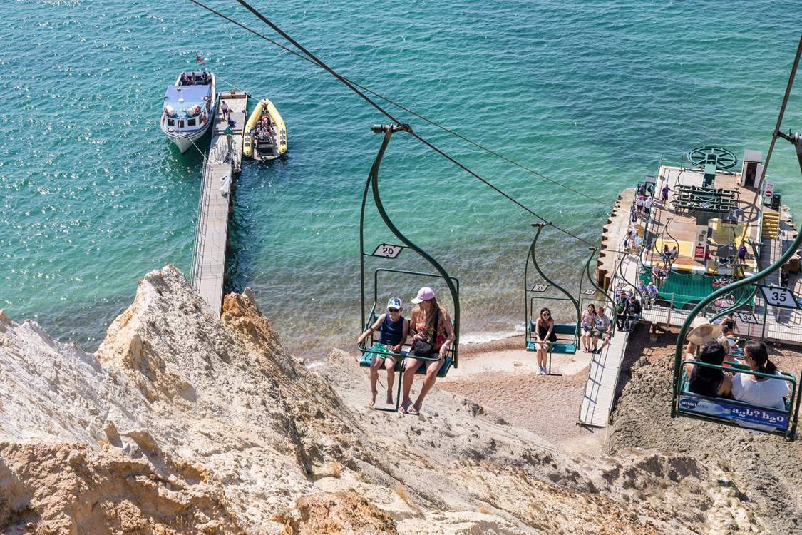 Take the chairlift to the beach at Alum Bay where you can see the Needles landmark. 