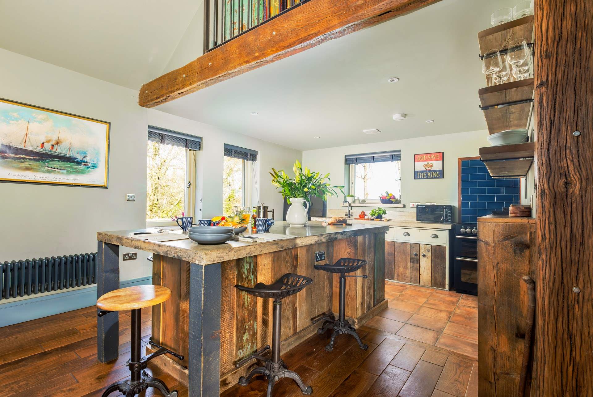 The bespoke kitchen is well-equipped.