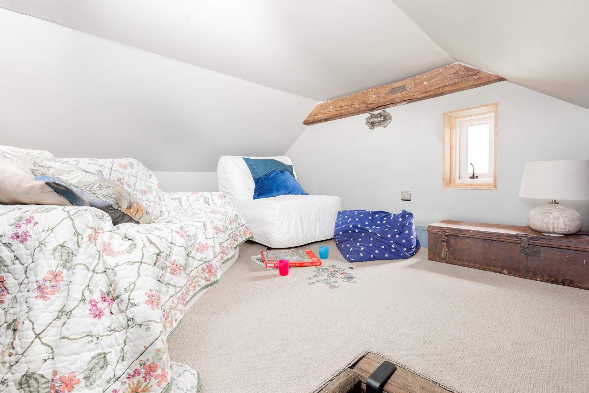 The stairs lead up to the a mezzanine level - an ideal space for playing games.