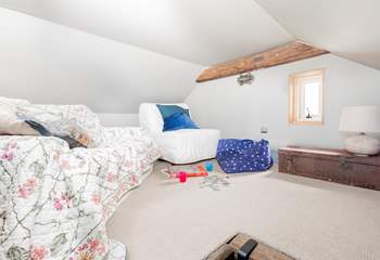 The stairs lead up to the a mezzanine level - an ideal space for playing games.