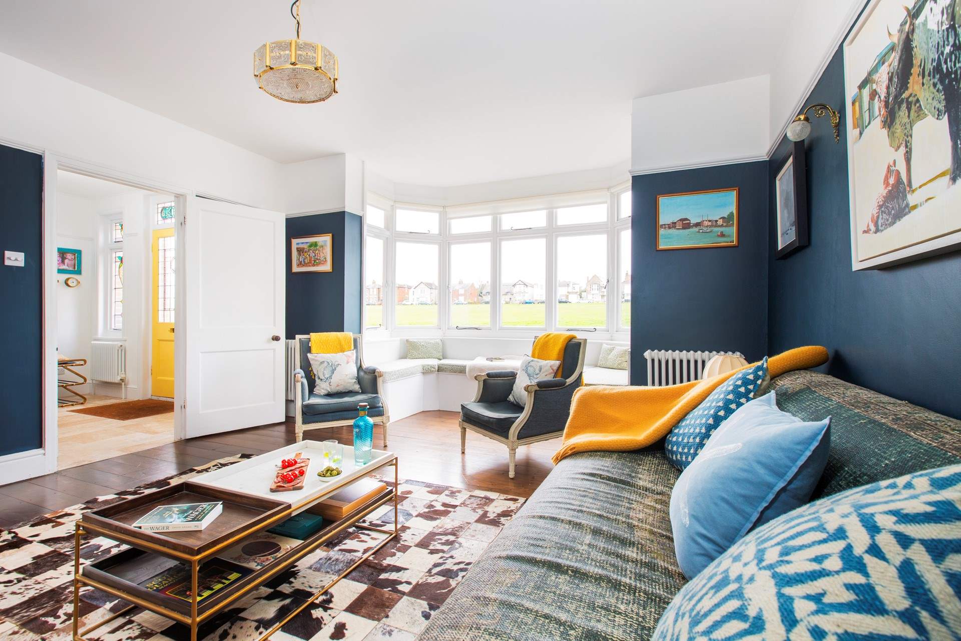 Views over the green can be found from the comfy sitting-room.