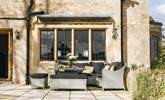 The outside seating-area next to the sitting-room is perfect to catch some sunshine. - Thumbnail Image