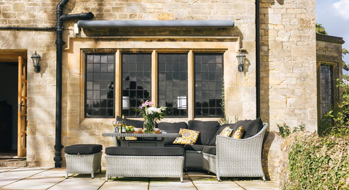 The outside seating-area next to the sitting-room is perfect to catch some sunshine.