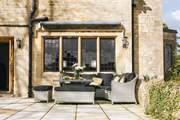 The outside seating-area next to the sitting-room is perfect to catch some sunshine.