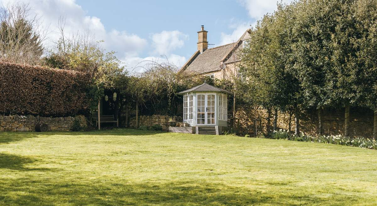 There is a cute little summer-house at the top of the garden.