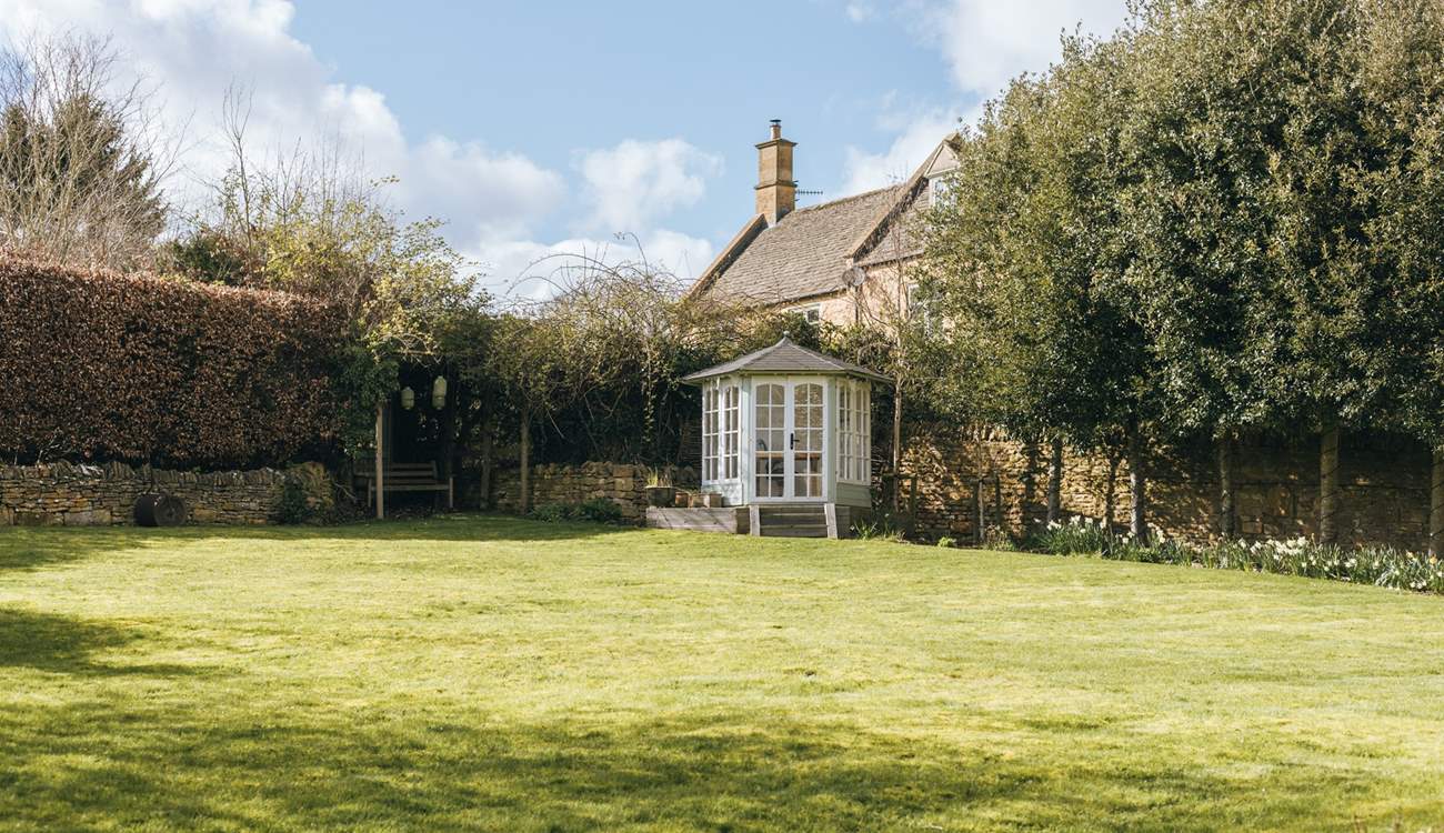 There is a cute little summer-house at the top of the garden.