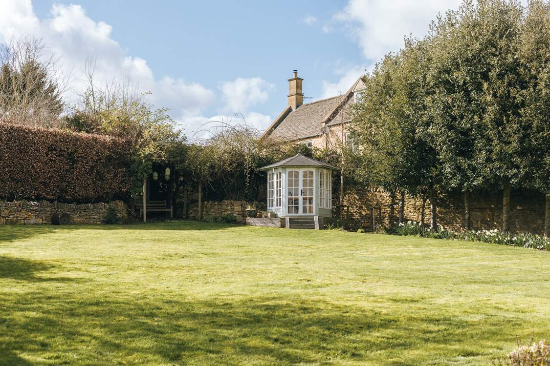 There is a cute little summer-house at the top of the garden.