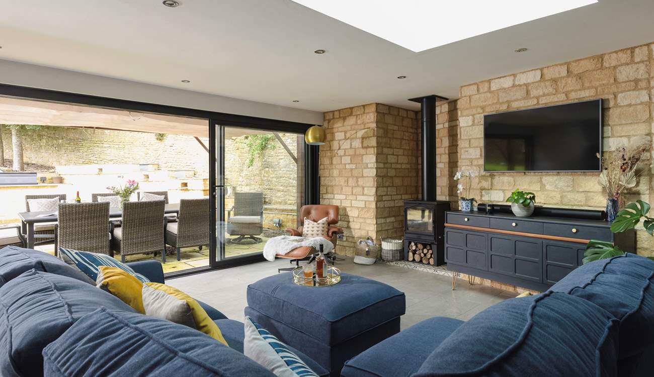 A lovely living area creates an inviting space to unwind in this open plan design. 