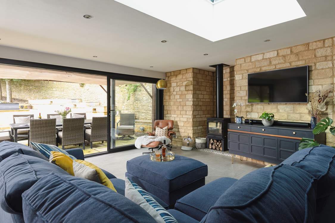 A lovely living area creates an inviting space to unwind in this open plan design. 