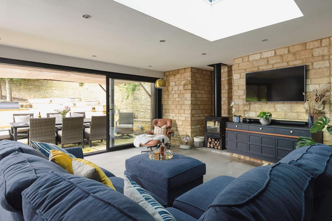 A lovely living area creates an inviting space to unwind in this open plan design.
