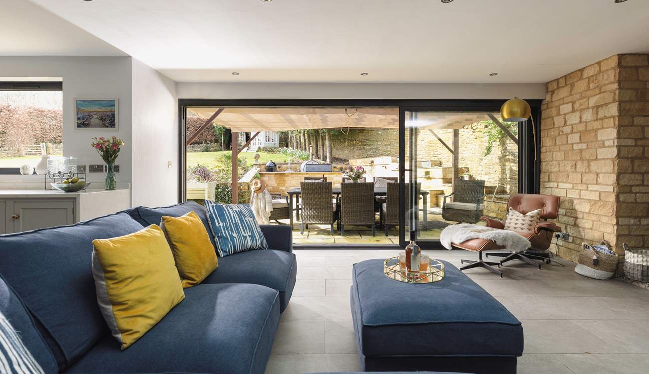 There is a delightful outdoor kitchen-area featuring a gas barbecue, pizza oven and smoker, perfect for al fresco dining and entertaining under the Cotswold skies.