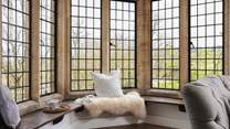 The double-aspect windows provide dreamy views across the village and there is a lovely window seat which lends itself to lazy days unwinding.