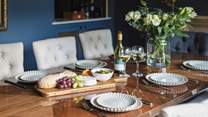 Chat the night away with family and friends around this refined dining-table.
