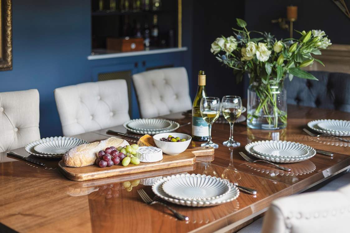 Chat the night away with family and friends around this refined dining-table.