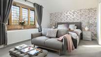 The main bedroom boasts an opulent super-king bed and comfy sofa.