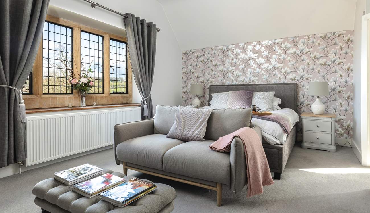 The main bedroom boasts an opulent super-king bed and comfy sofa.