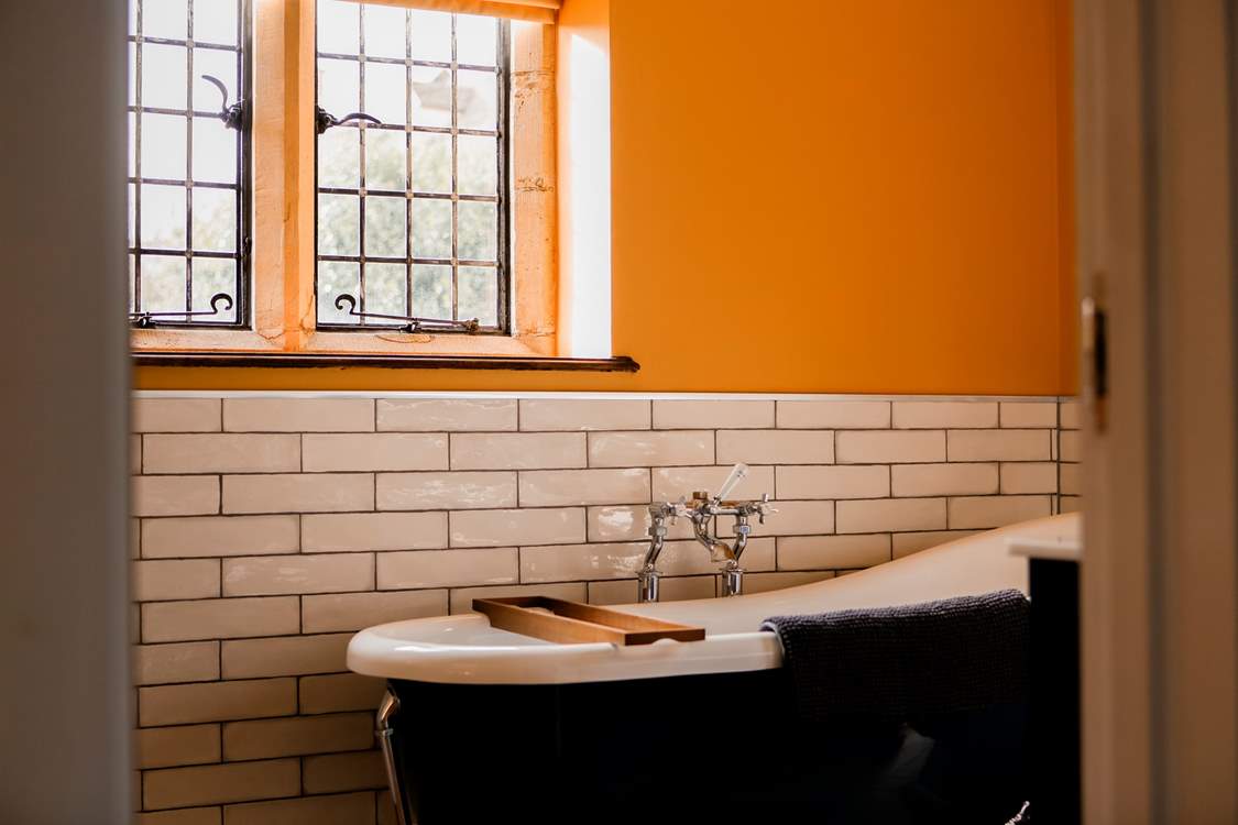 Savour a long, leisurely soak in the roll-top bath tub.