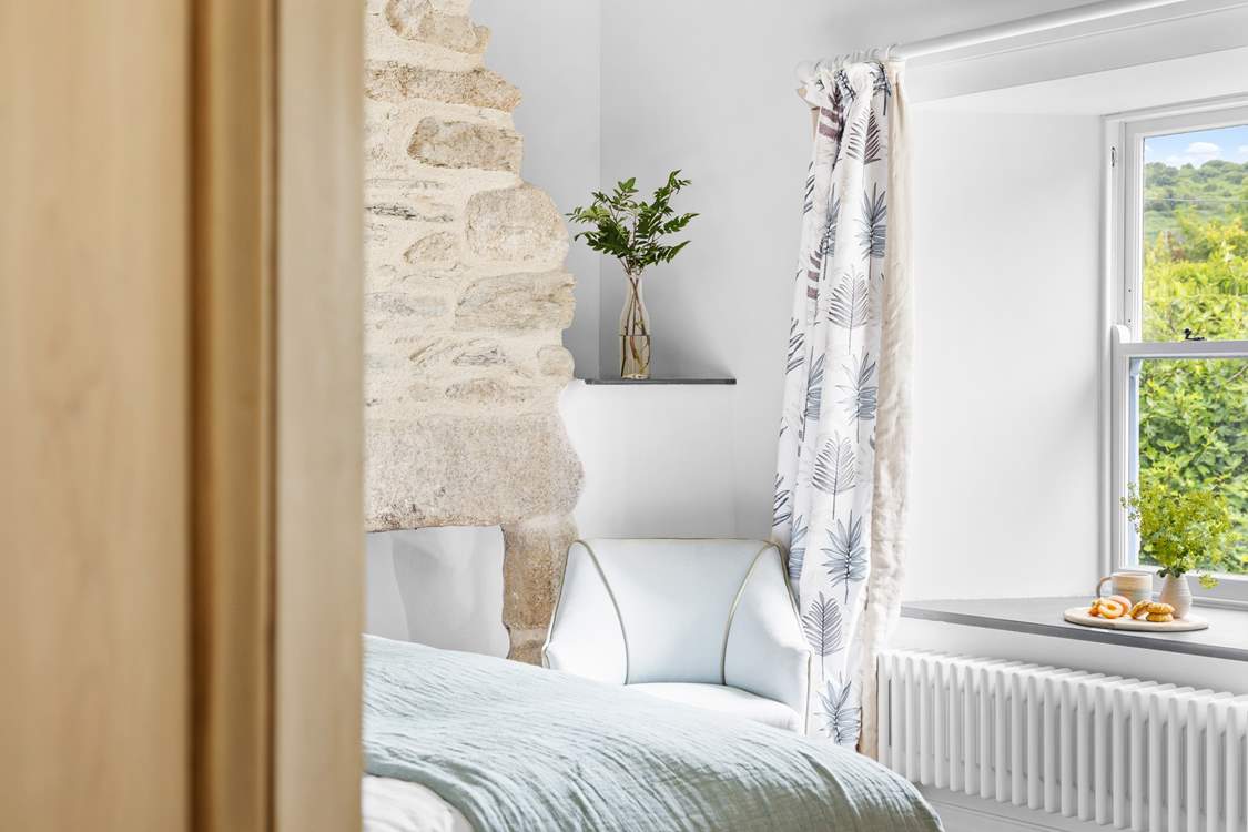 The bedrooms have a calming feel.