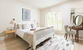 Muted tones make for a relaxing bedroom. - Thumbnail Image