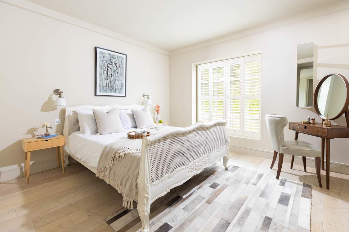 Muted tones make for a relaxing bedroom.