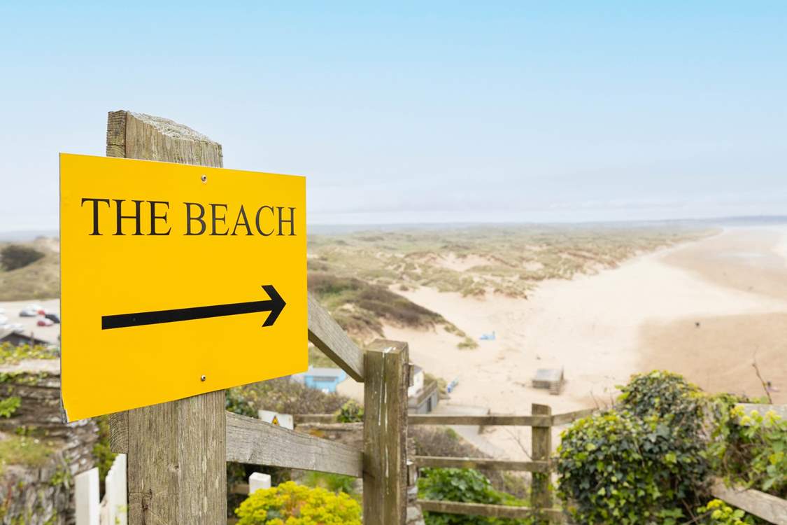 Follow the private path down to the beach from the front door of your apartment.