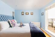 The principal bedroom has a luxurious king-size bed with sea views and its own balcony.