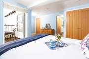 The large principal bedroom has a balcony and en suite shower-room.