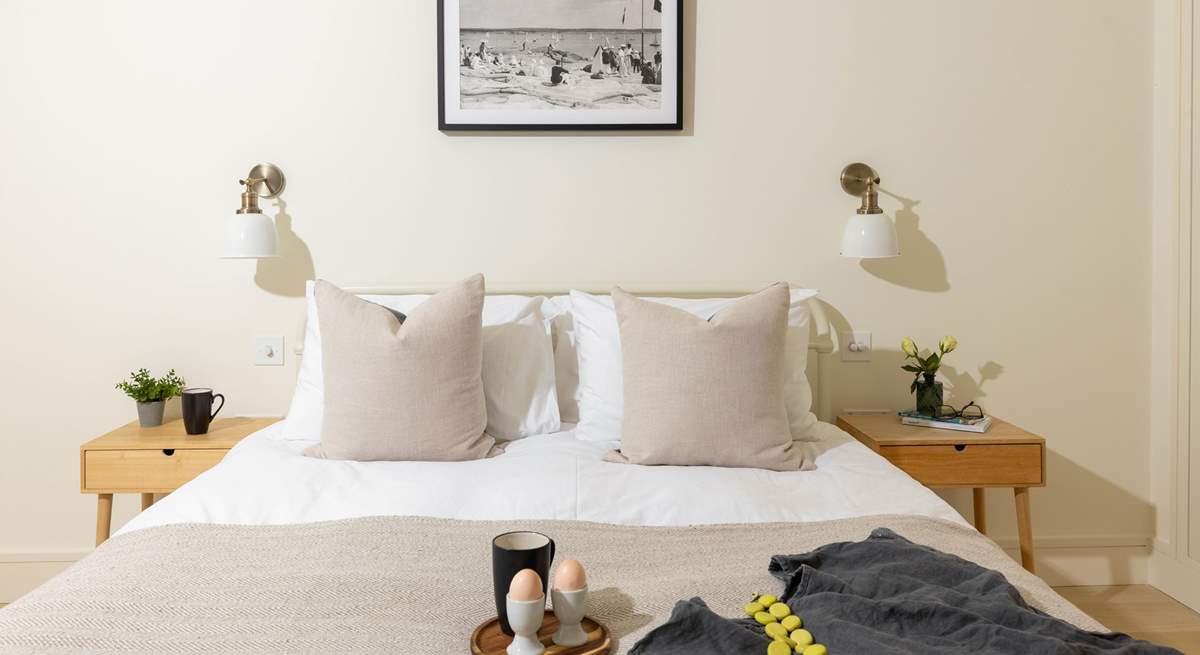 Each bedroom has a lovely coast-themed print.