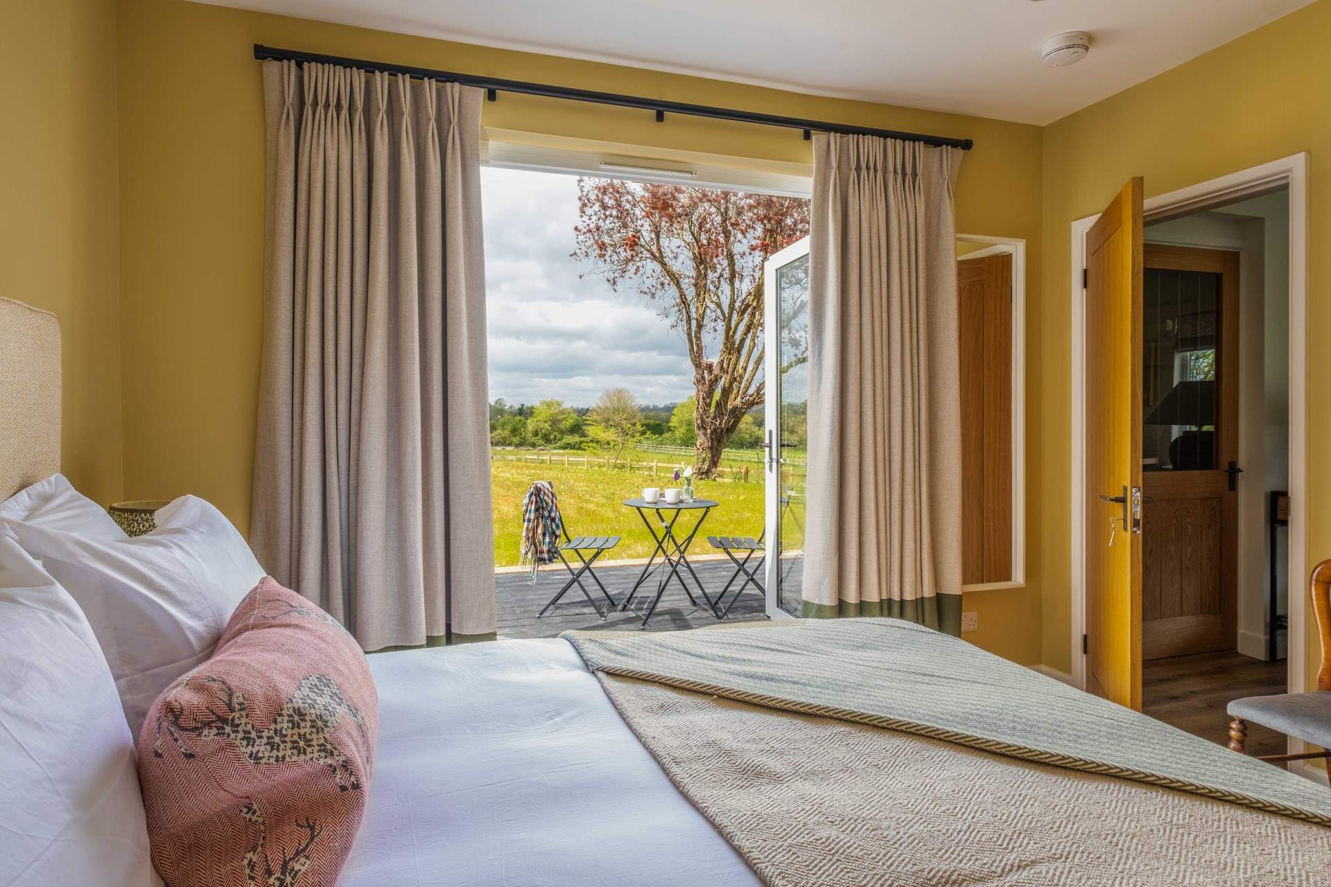 Double doors open to the patio and garden.