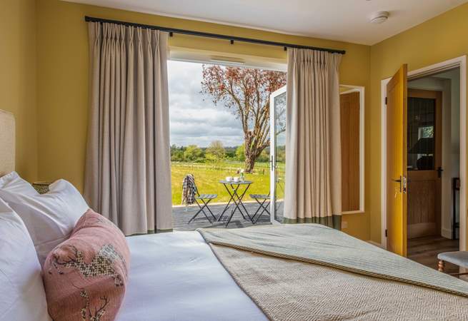 Double doors open to the patio and garden.