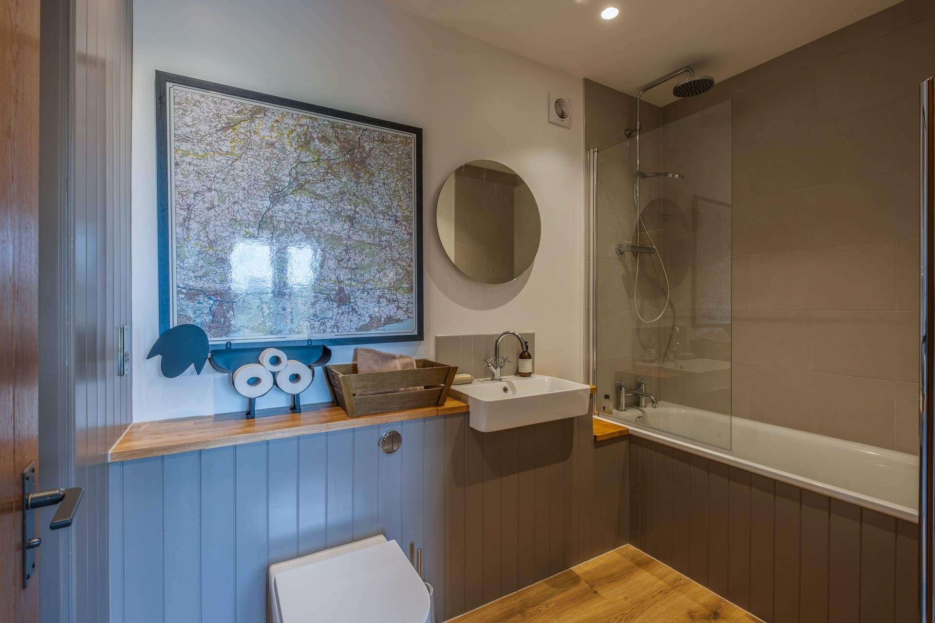 The bathroom has a shower and bath.