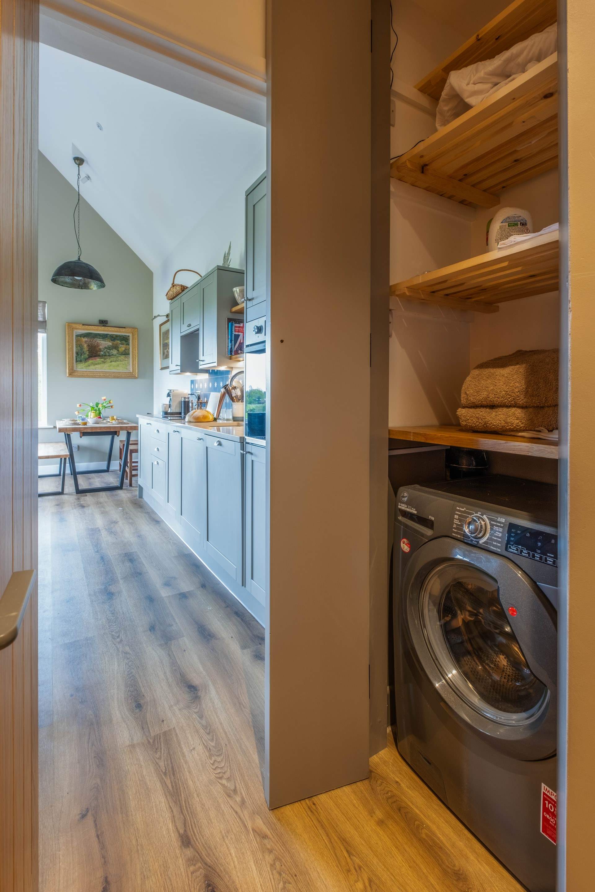 Utility cupboard with washing machine.
