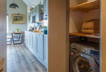 Utility cupboard with washing machine.