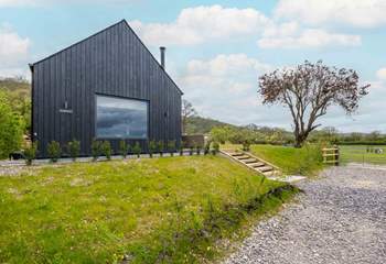 Steps from the parking area lead to the barn.