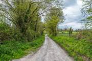 The lane leading to the property. Take care with low slung cars.