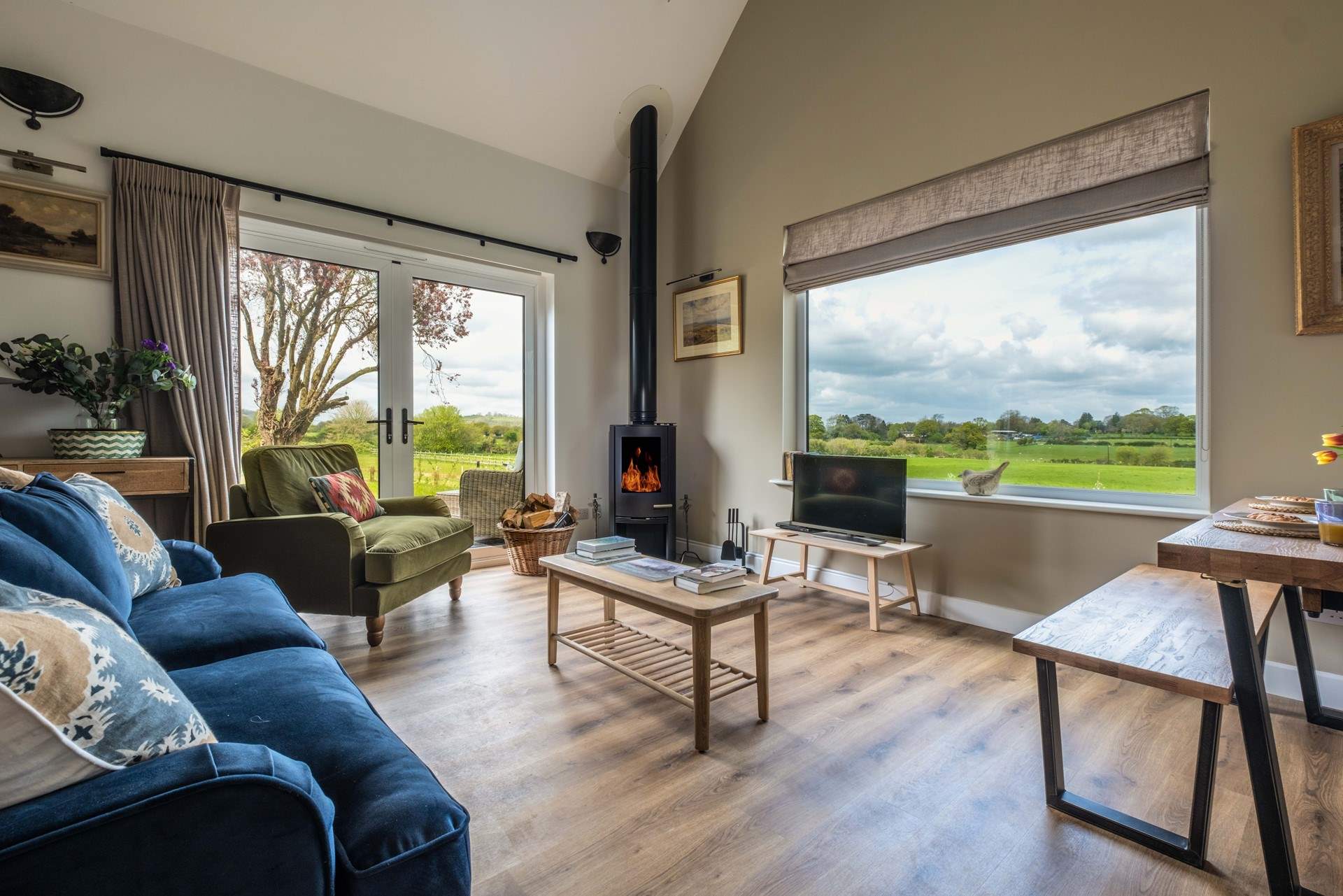 The open plan living area is a welcoming space with views of the surrounding countryside.