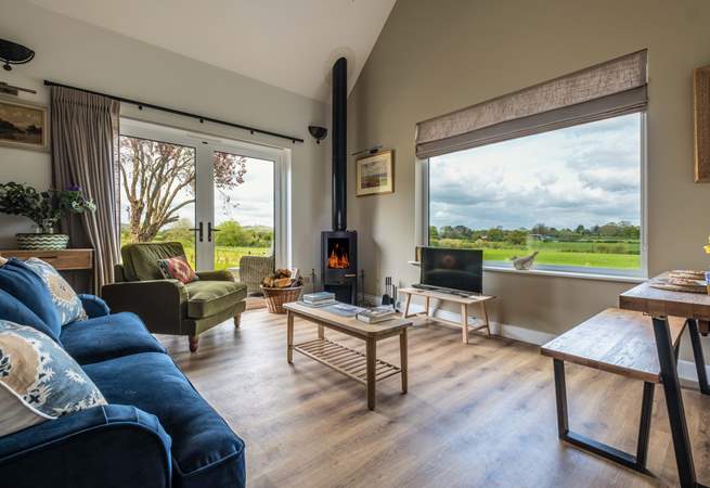 The open plan living area is a welcoming space with views of the surrounding countryside.